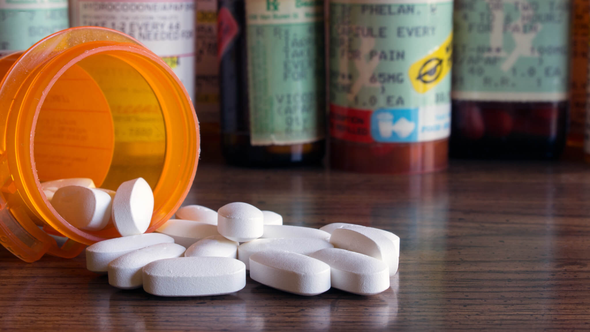 Opioids, medicine bottle with pills