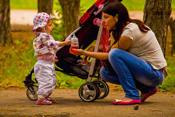 Woman with baby and stroller