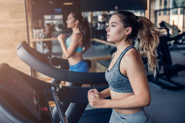 Women running on treadmill