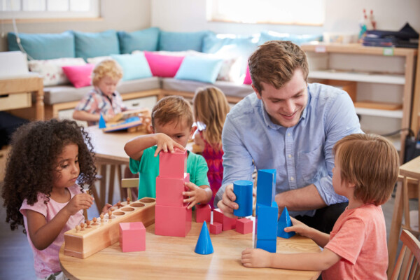 male teacher with students