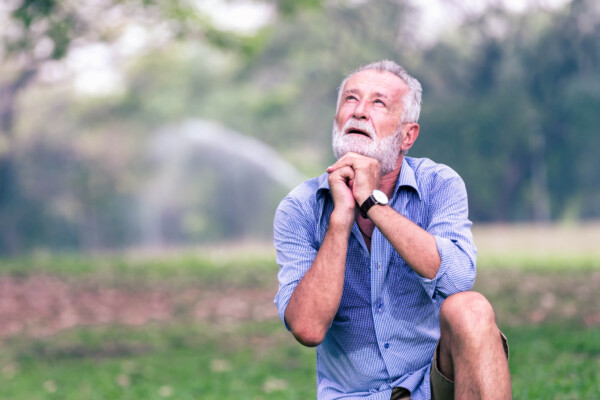 Older man praying