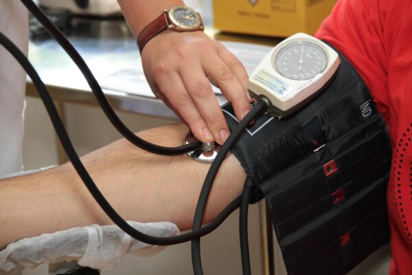 Person having blood pressure taken