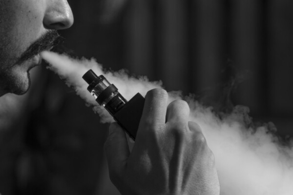 Man vaping with an e-cigarette