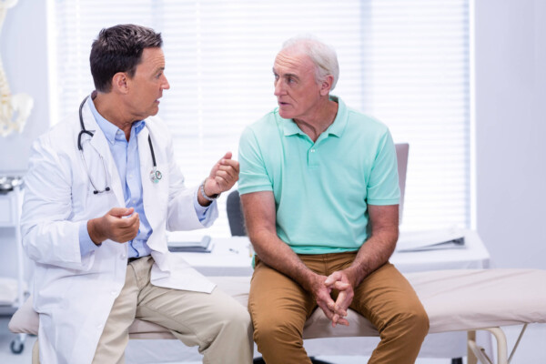 Doctor talking with patient