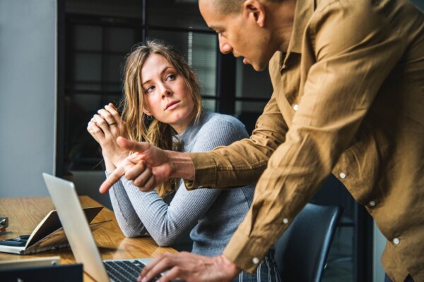Coworkers having discussion in office