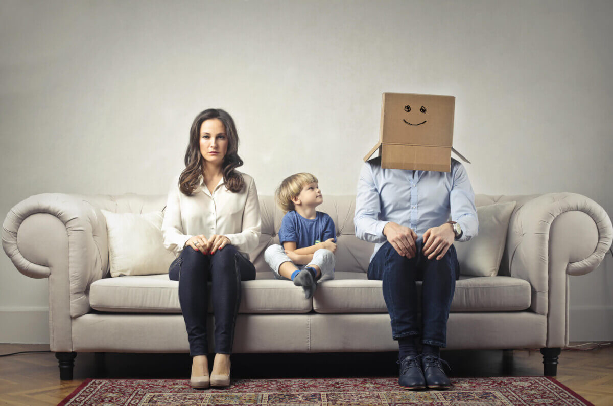 Mother with young son, Father with box on his head