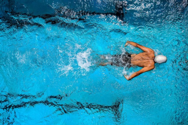 Person swimming in pool