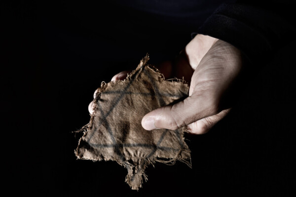 Man with a ragged Jewish badge from Holocaust