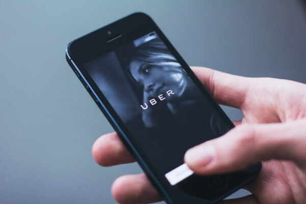 Person using Uber app on phone