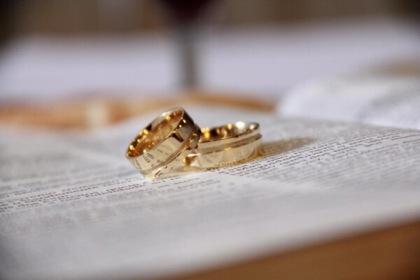 Wedding rings on top of a Bible