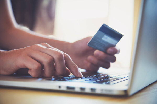Person online shopping with credit card