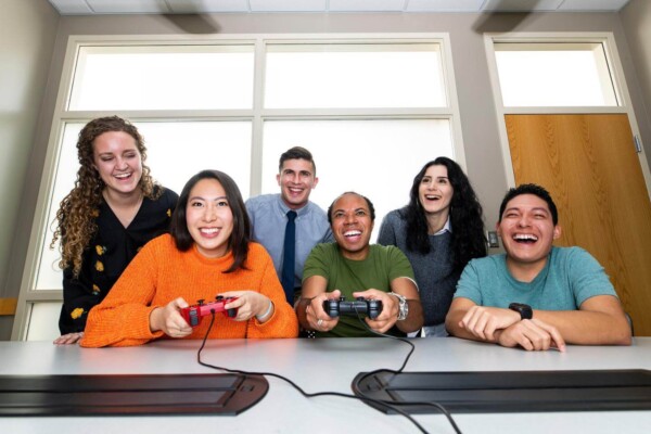 Office workers playing video game