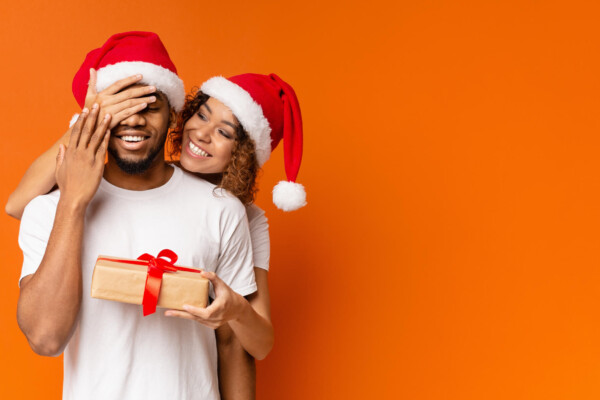 Girlfriend or wife giving partner a Christmas gift