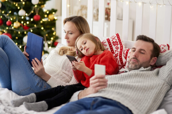 Family using their phones on Christmas