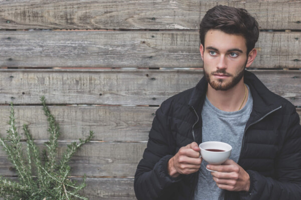 Man with beard drinking coffee