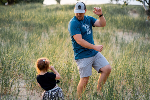 Father dancing with little girl