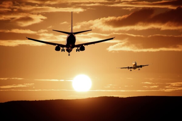 Commercial airplanes in sunset