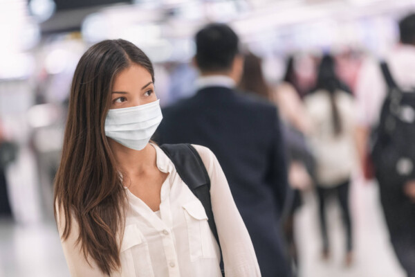 Woman wearing face mask at airport amid virus outbreak