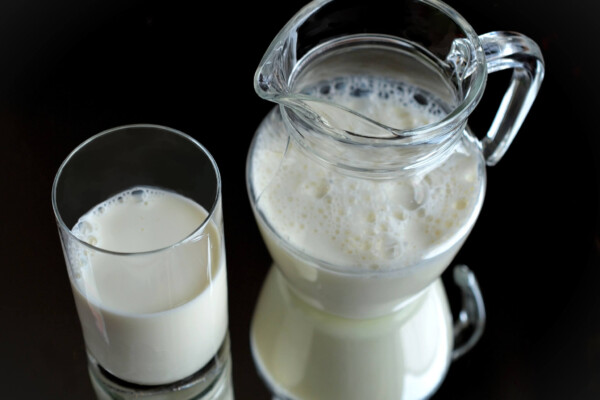 Jar and glass of milk