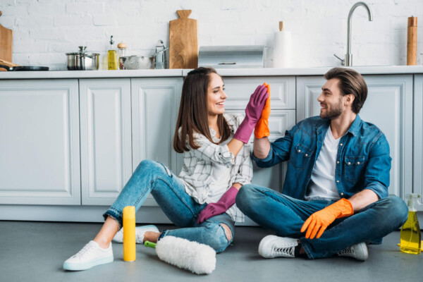Couple doing house cleaning