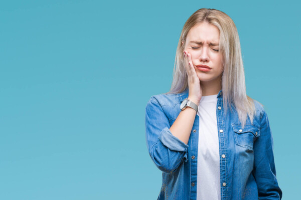 Woman with a toothache in pain