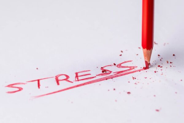 Stress written on notepad in red pencil