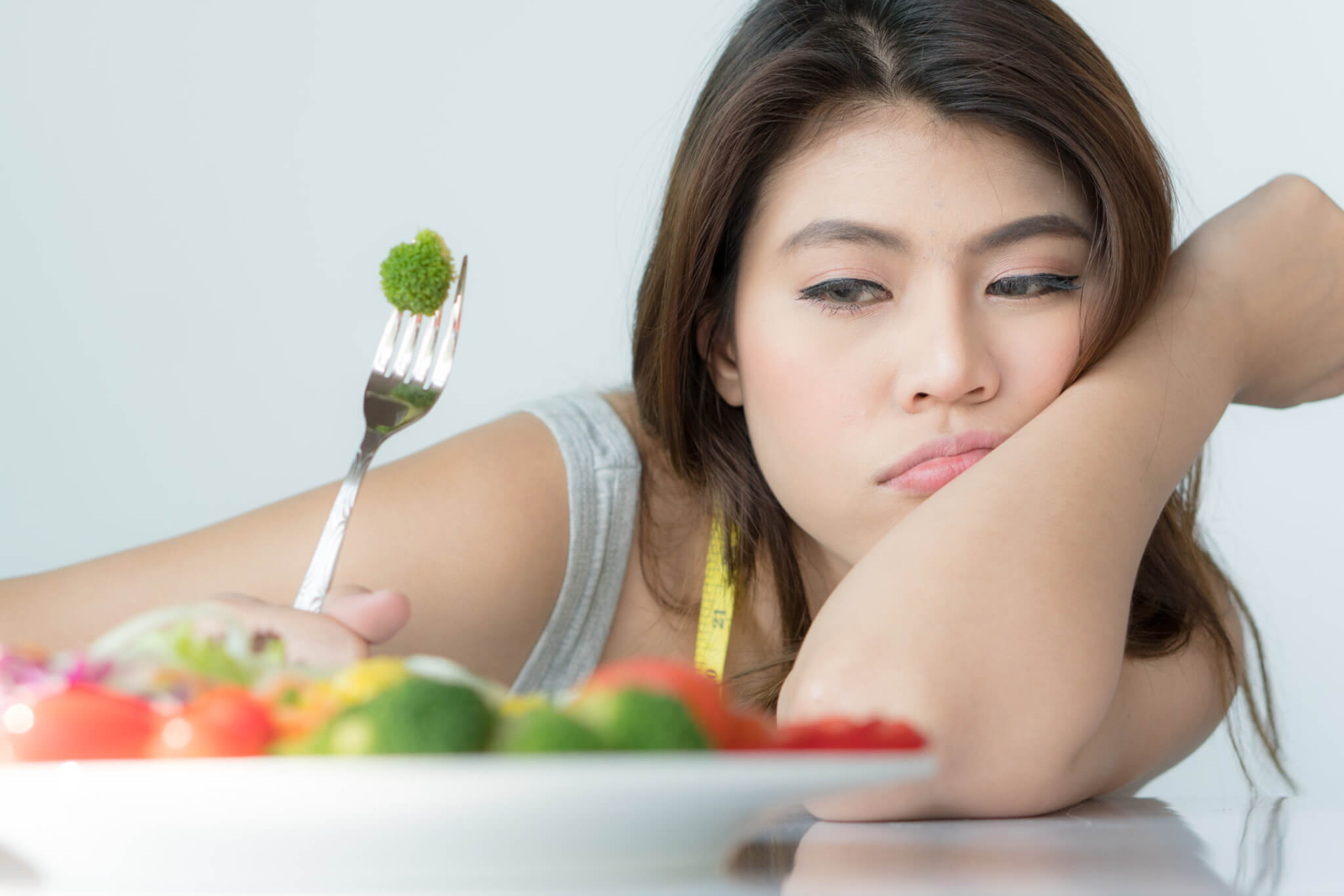 Woman doesn't want to eat vegetables or salad