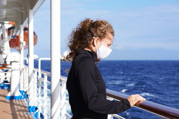 Woman wearing mask on cruise ship during coronavirus outbreak