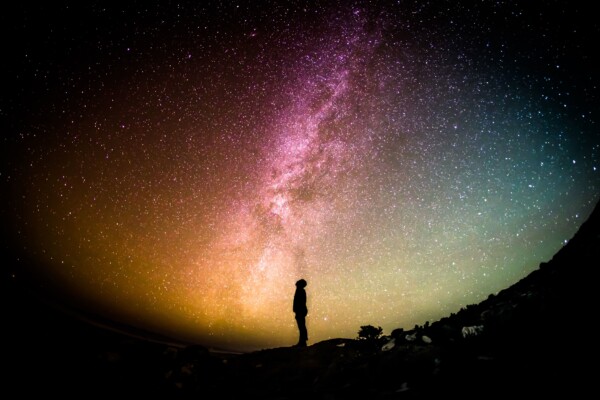 Person looking at stars, planets in night sky