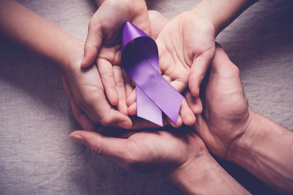 Adult and child hands holding purple ribbons, Alzheimer’s disease, Pancreatic cancer, Epilepsy awareness, world cancer day, domestic violence concept