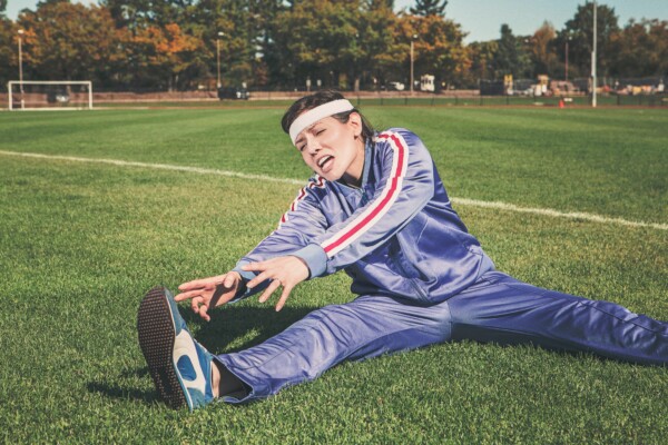 Woman in pain while stretching or working out