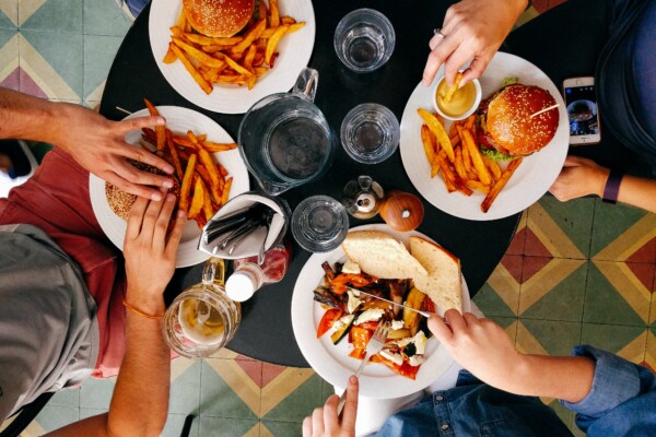 People eating burgers at a restaurant