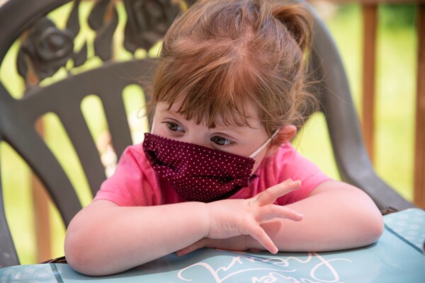 Little girl wearing face mask during coronavirus / COVID-19 outbreak