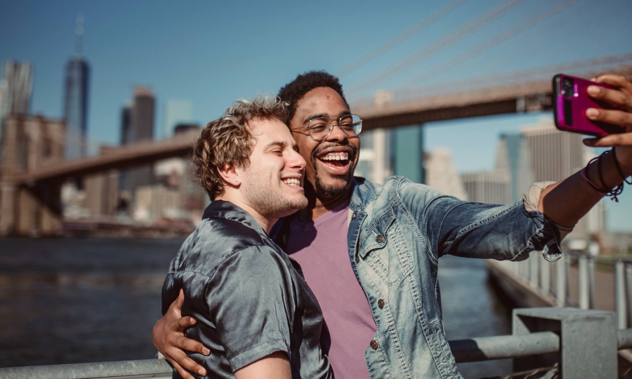 Men, couple taking selfie together