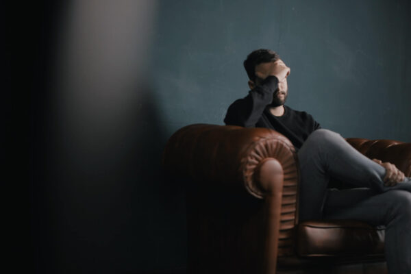 Man Alone On Couch, Sad, Stressed