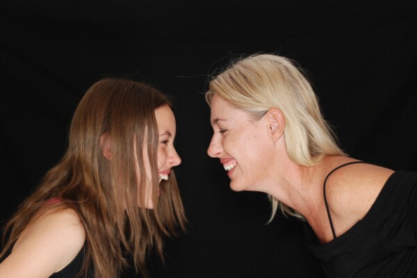 Women laughing at each other