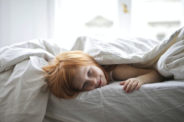Child lying in bed