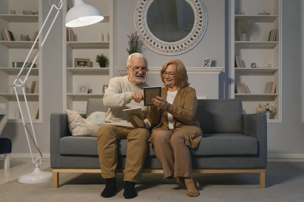 Older couple looking at photos