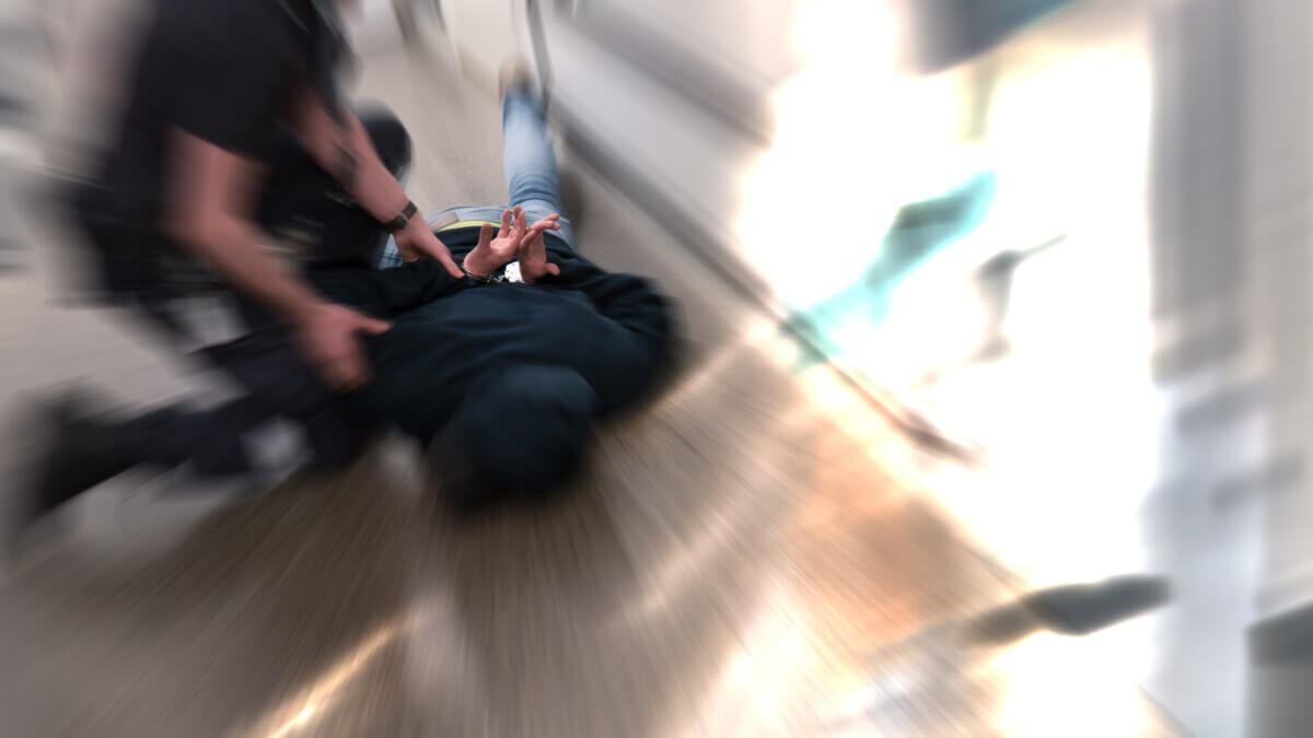 Prison guard fight inmate resisting arrest in prison after commiting crime. Dramatic effect double exposure.