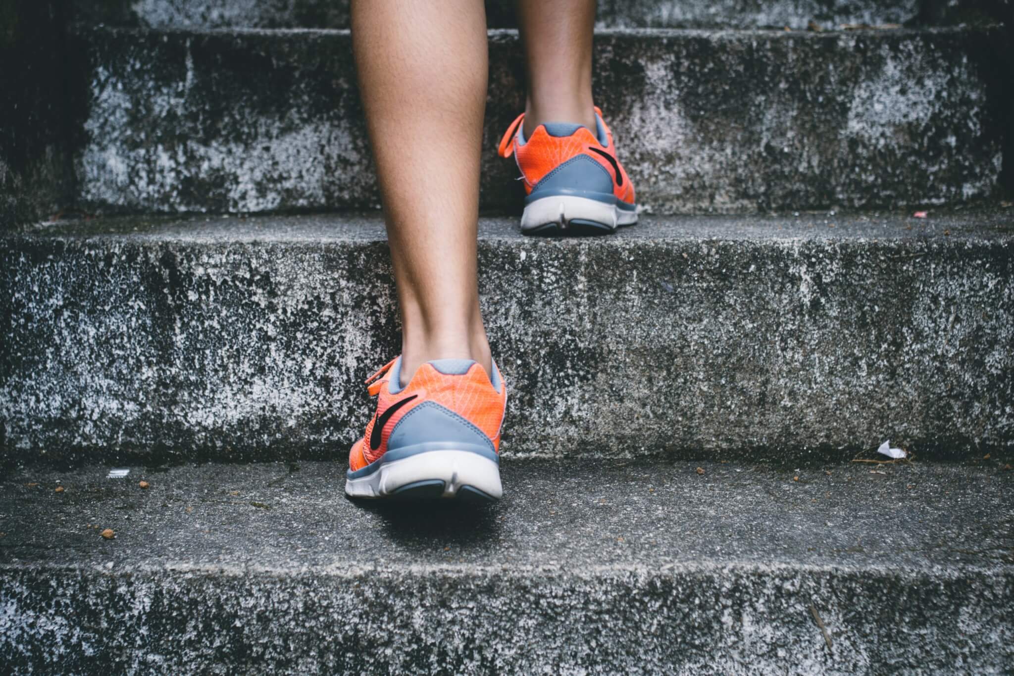Person walking up stairs, steps for exercise