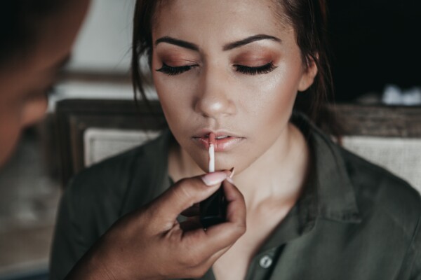 Woman having her make-up applied