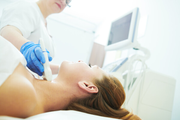 Woman undergoing thyroid cancer screening