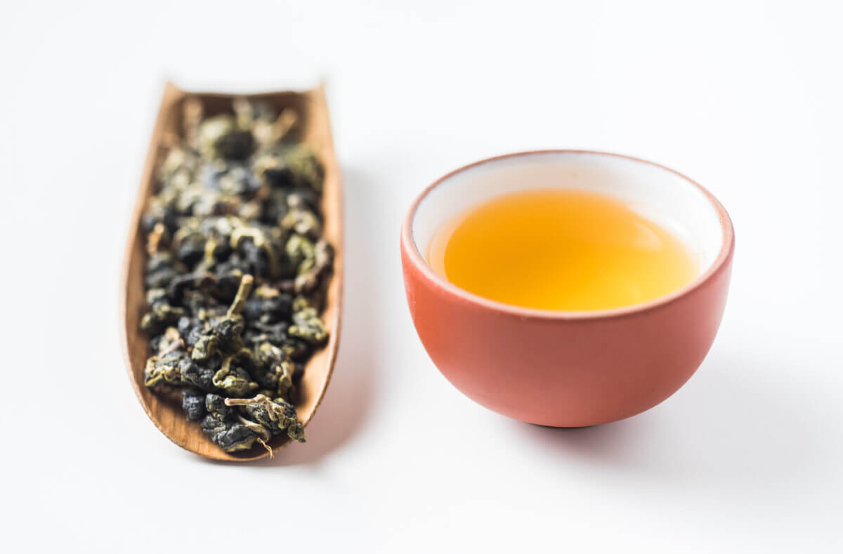 Oolong tea leaves and tea cup.