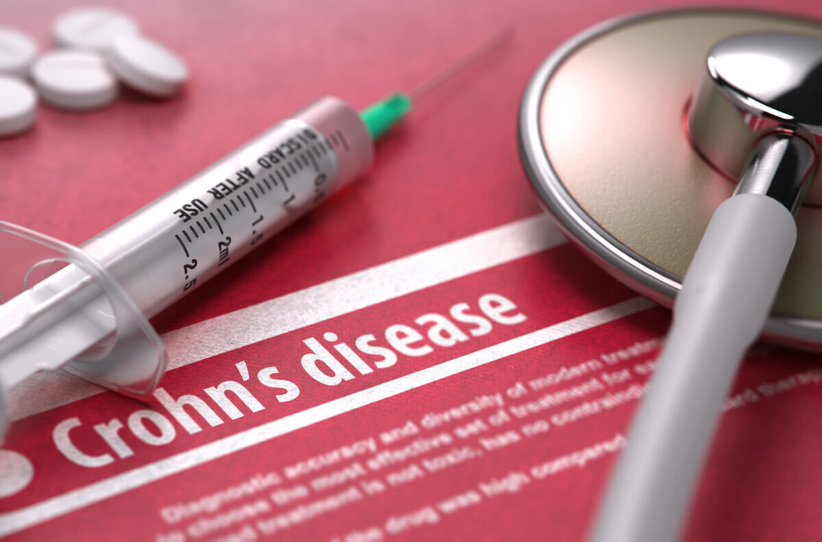 Crohn’s disease. Medical Concept on Red Background.