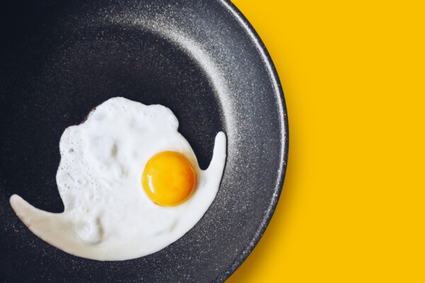 Egg being cooked on non-stick frying pan