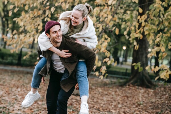 Playful couple walking in the park