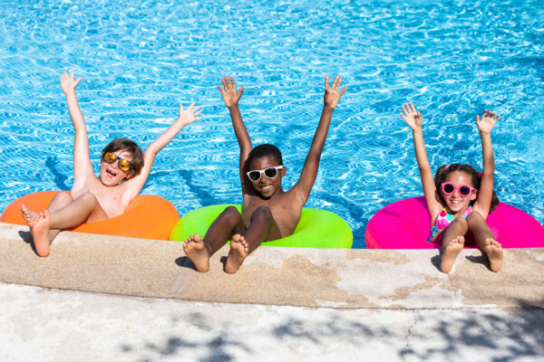 Children having summer pool party