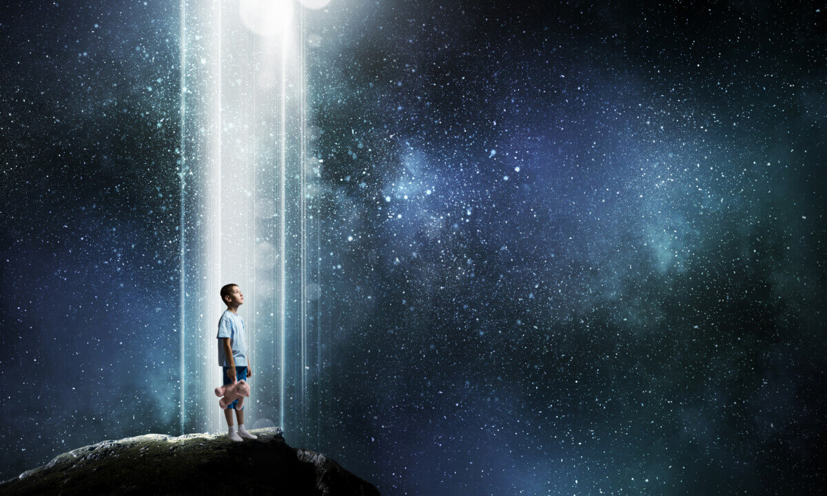 Boy holding a teddy bear in a dream