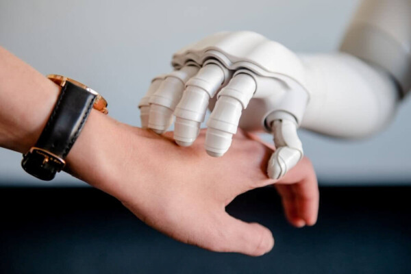 Robot hand touching human hand