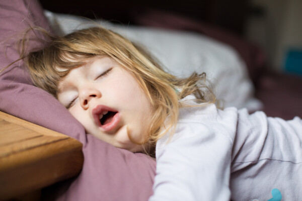 Child sleeping in bed